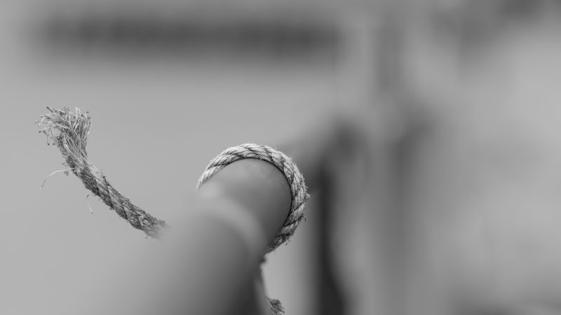 rope tied on rail